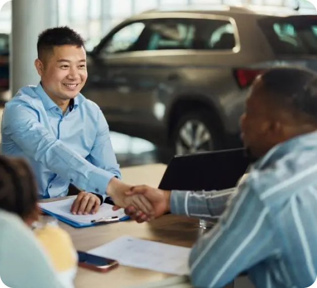 Salesperson shaking hands with customer